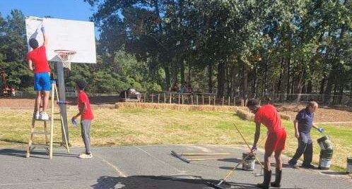 Boys Basketball works on the MES playground