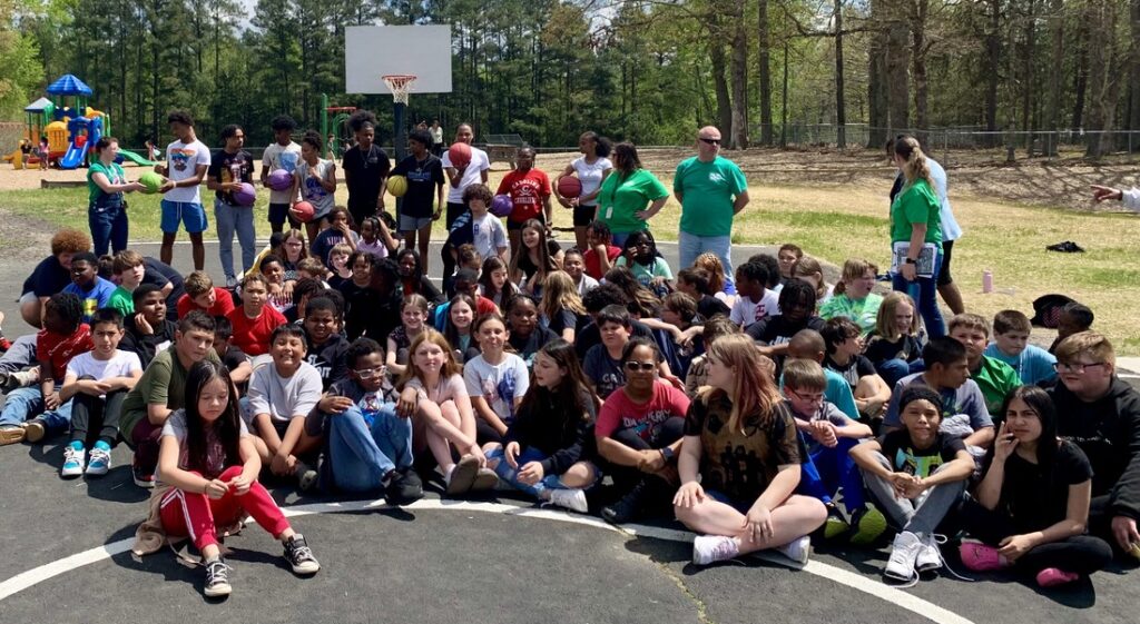 CHS Basketball students visited MES to celebrate the updated basketball court.
